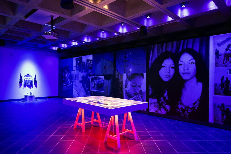 Walls of the gallery covered with large photographs from the Guadalupe Rosalese show