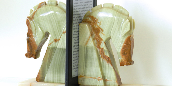 a kindle held upright by bookends