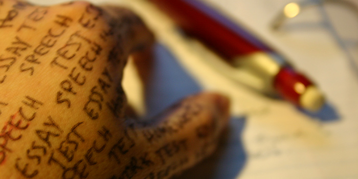 A hand with words written on the skin in pen