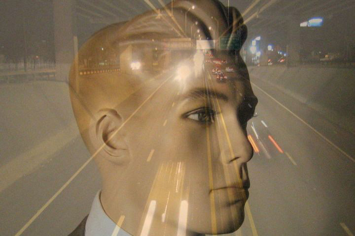 Image of a highway at night overlaid onto a mannequin's head