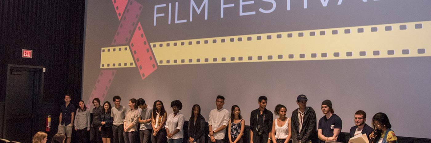 Film festival participants line up to receive their awards