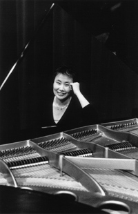 Woman sitting at a piano