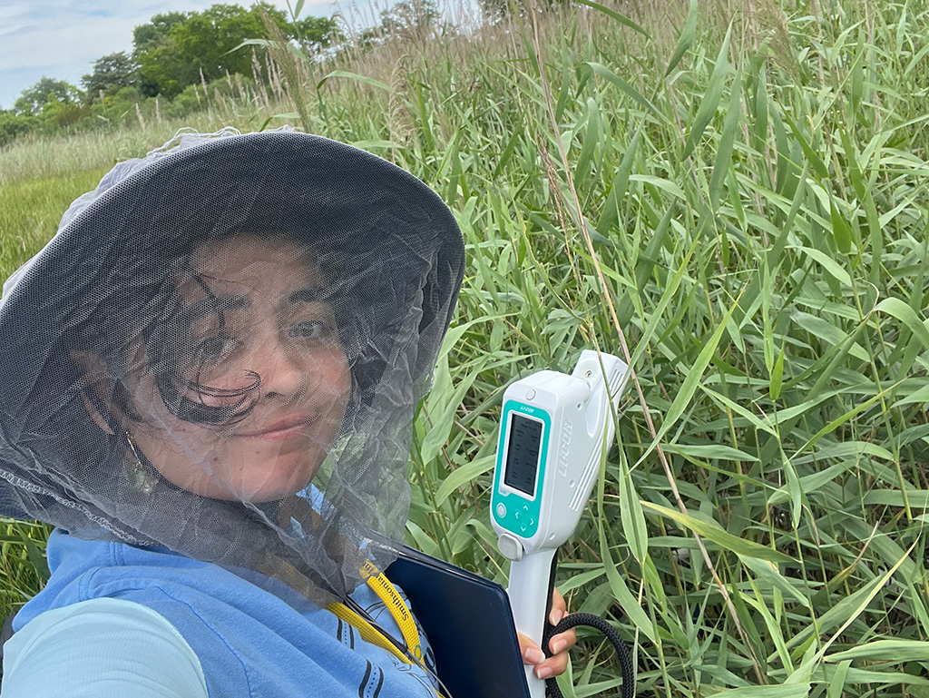 Adelma Argueta Roman’24 out in the field researching wetland ecosystems at the Smithsonion Environmental Research Center