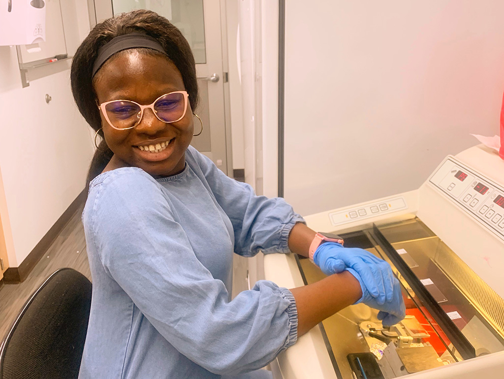 Charlene Frimpong’26 conducting neuroscience research using a cryostat