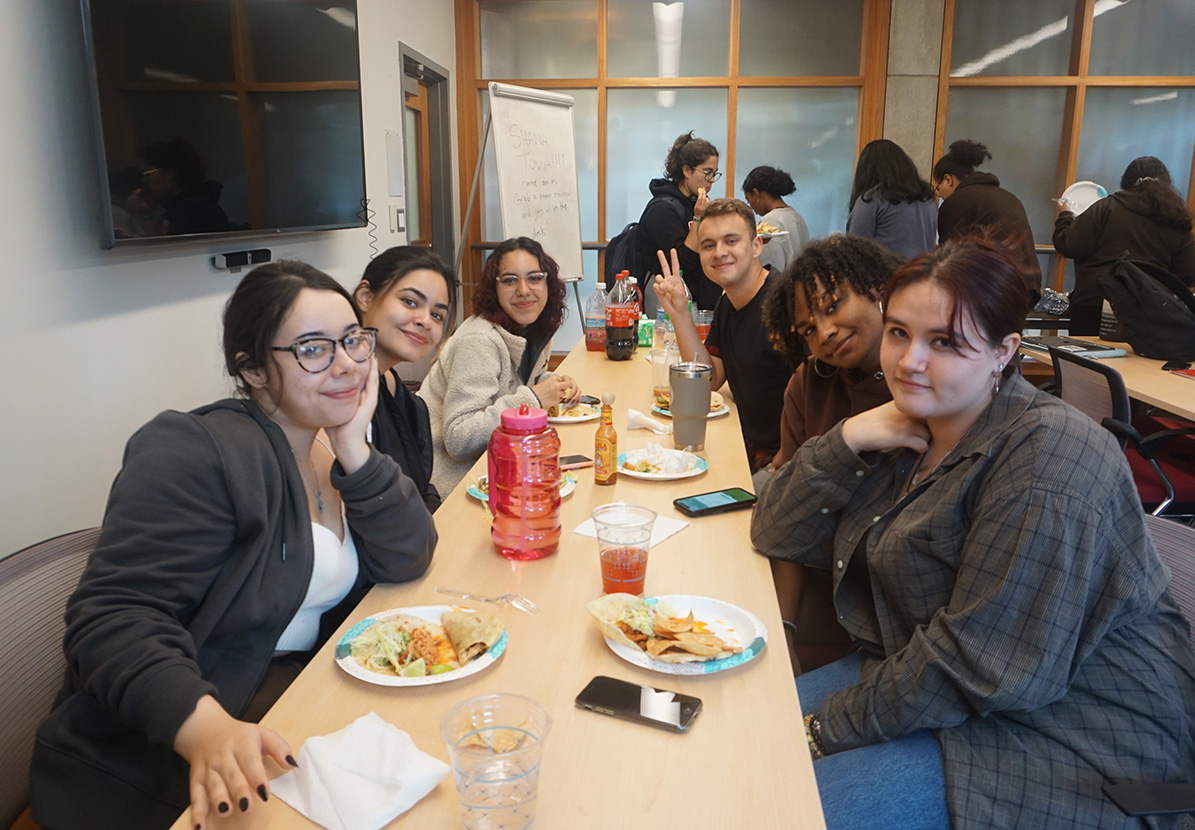 Chesick Scholars around a table for family dinner