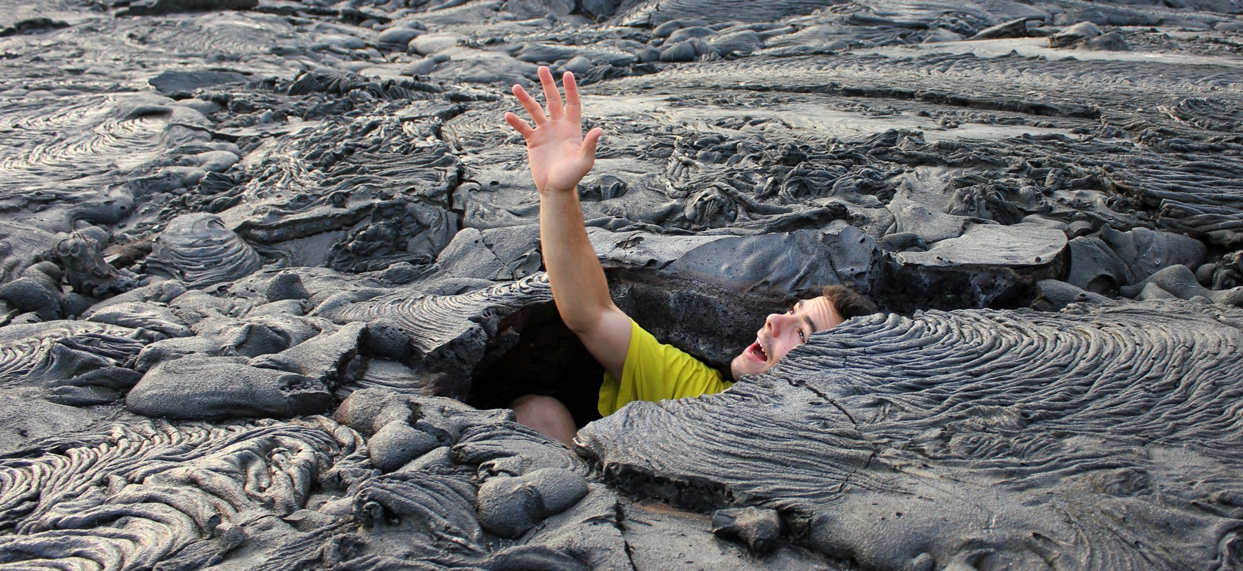 Student pretending to be caught in a lava flow