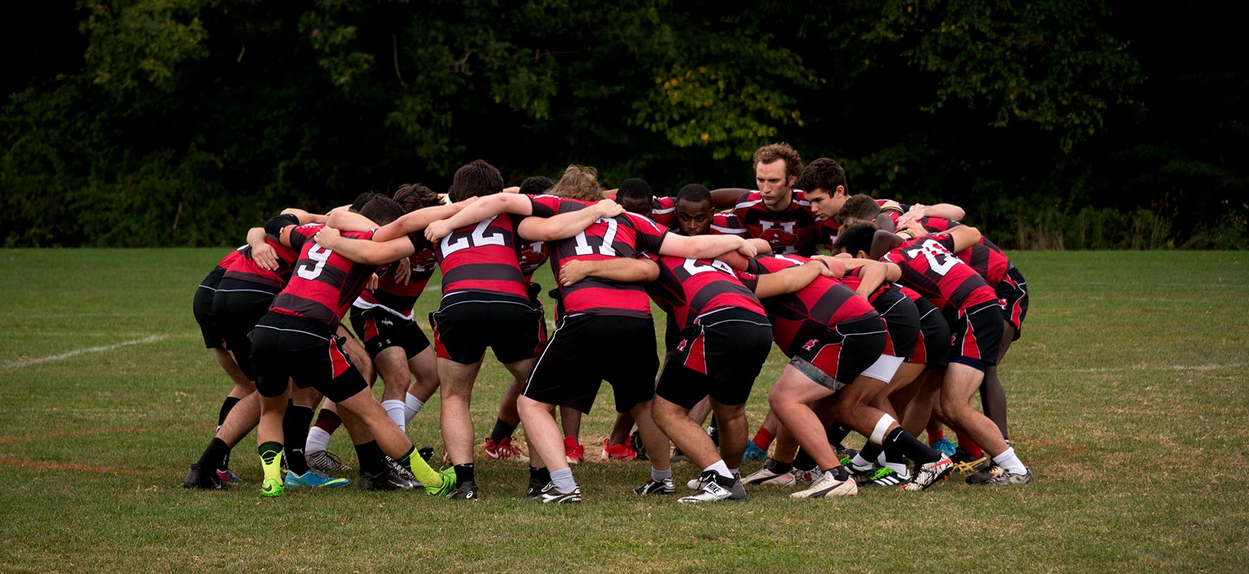 The Rugby team in a huddle.