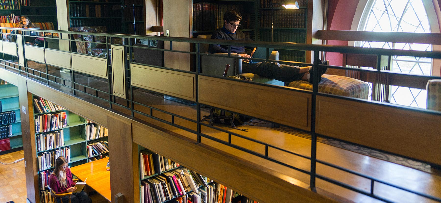 Student studying inside of Magill Library