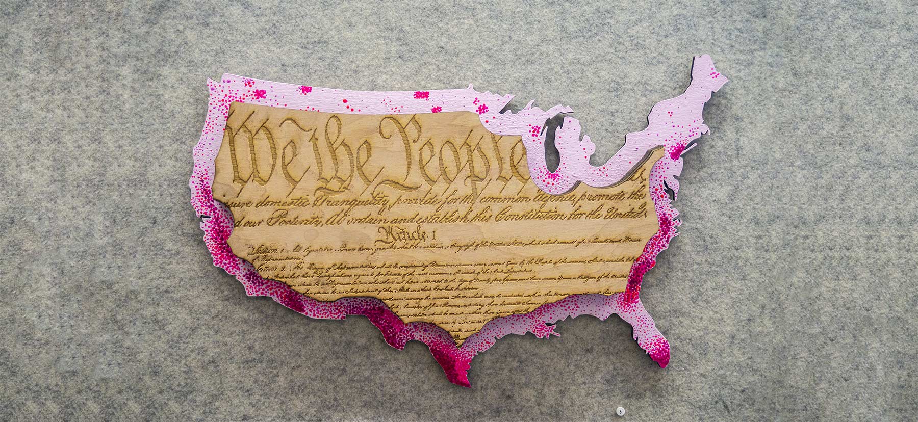 we the people etched into an outline of the united states