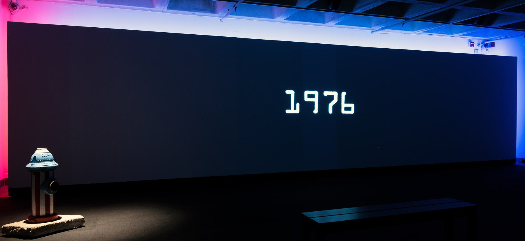 Projected image of film displaying type reading 1976