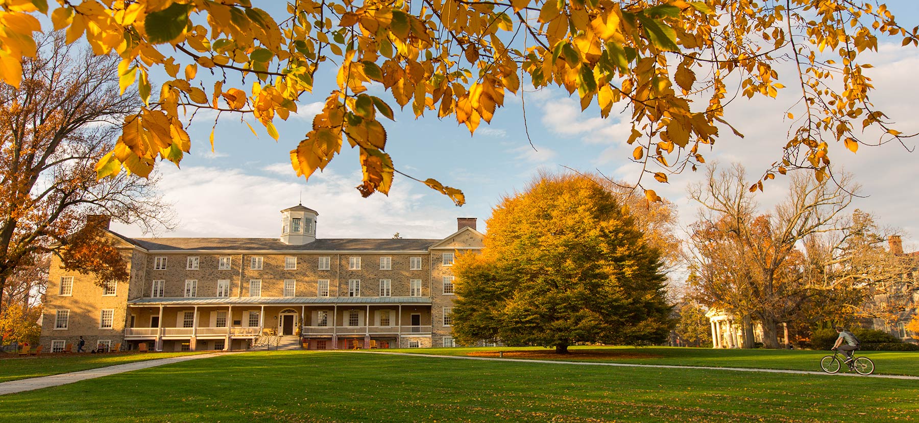 Founders Hall framed by fall foliage