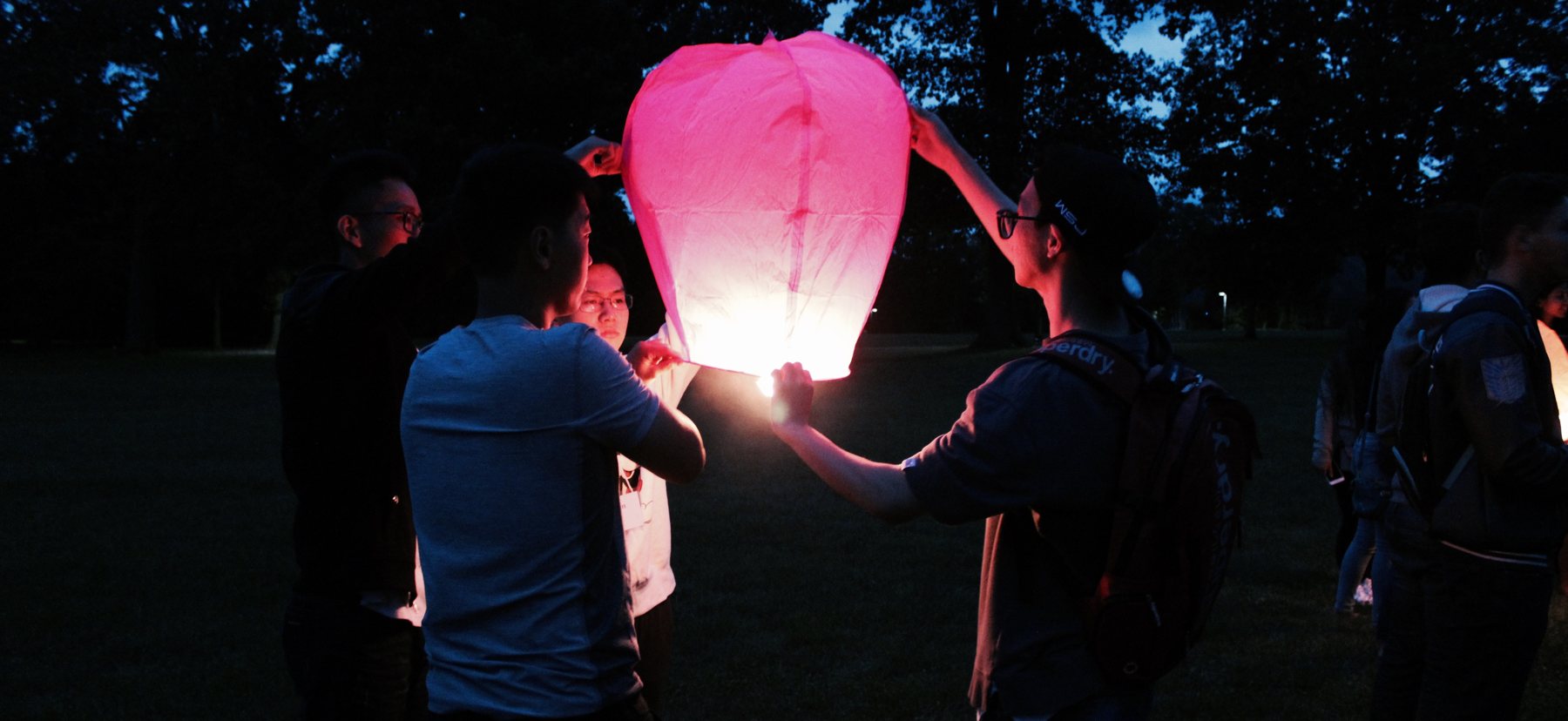 Students at night with lantern