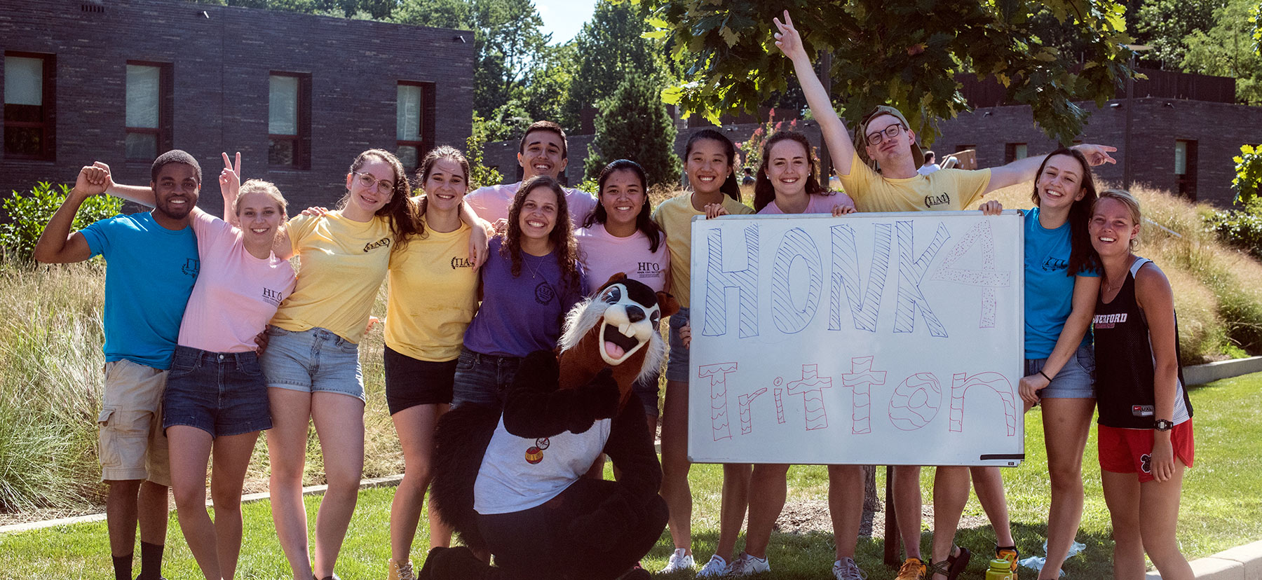 Group of students and the Black Squirrel with a Honk 4 Tritton sign