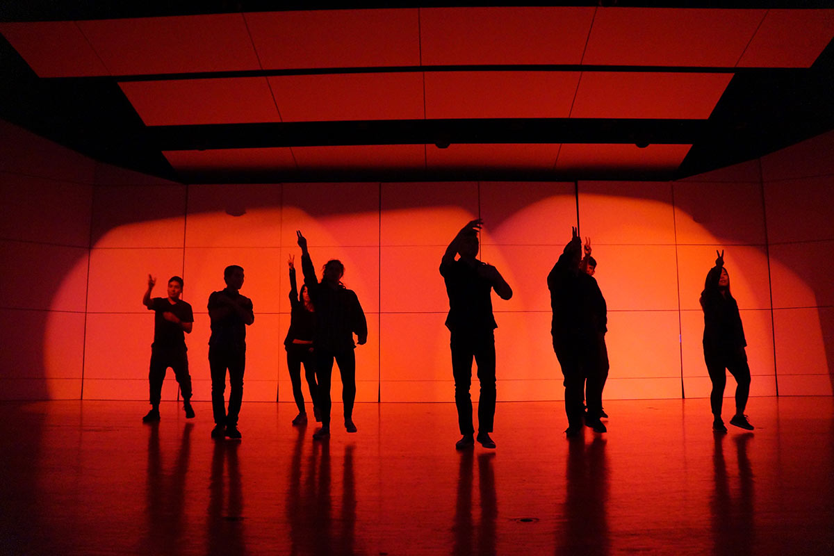 Silhouettes of dancers on a stage