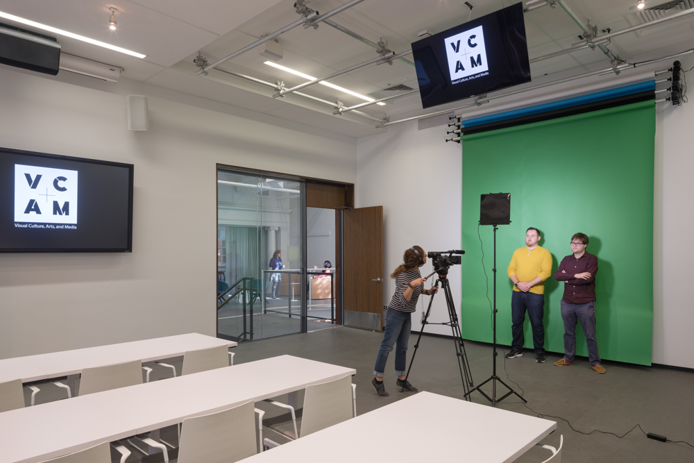 Students shooting with a green screen