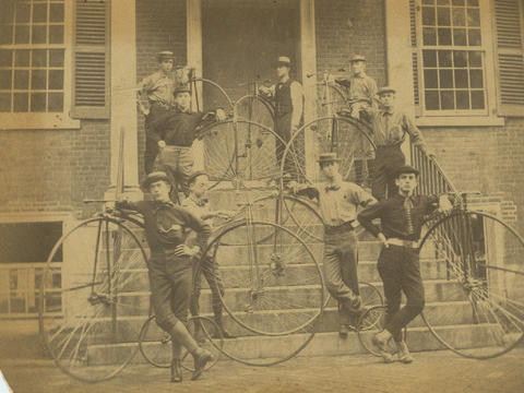 Students with bicycles outside Founders Hall