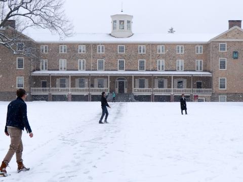 Students in front of Founders in the snow