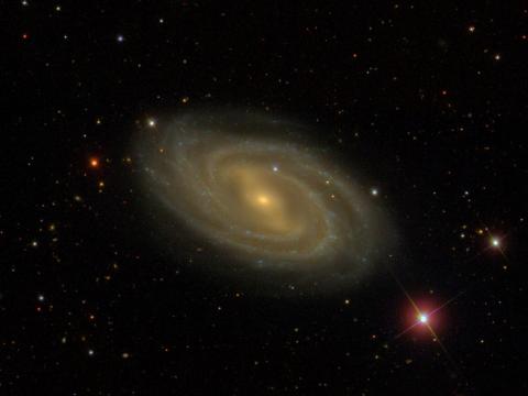 A swirling galaxy, known as Messier 109, that is around 85 million light years away in the direction of the Big Dipper.
