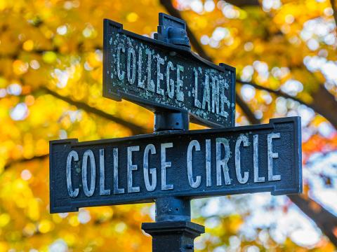 College Lane street sign in front of fall foliage