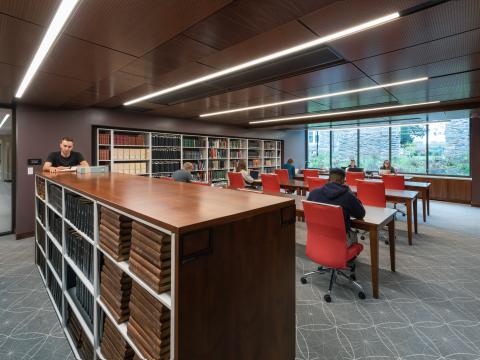 photo of the Quaker & Special Collections reading room, where several people are looking at materials and working
