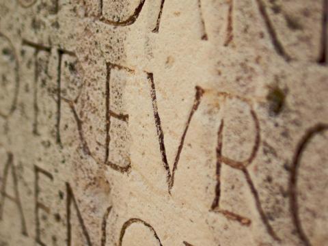 Latin phrases carved into stone