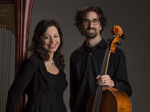 Lily Press '09 and Simon Linn-Gerstein '09 stand with their harp and cello, respectively, in front of a dark background.