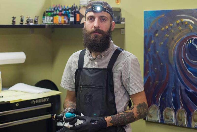 Justin Turkus in his tattoo parlor
