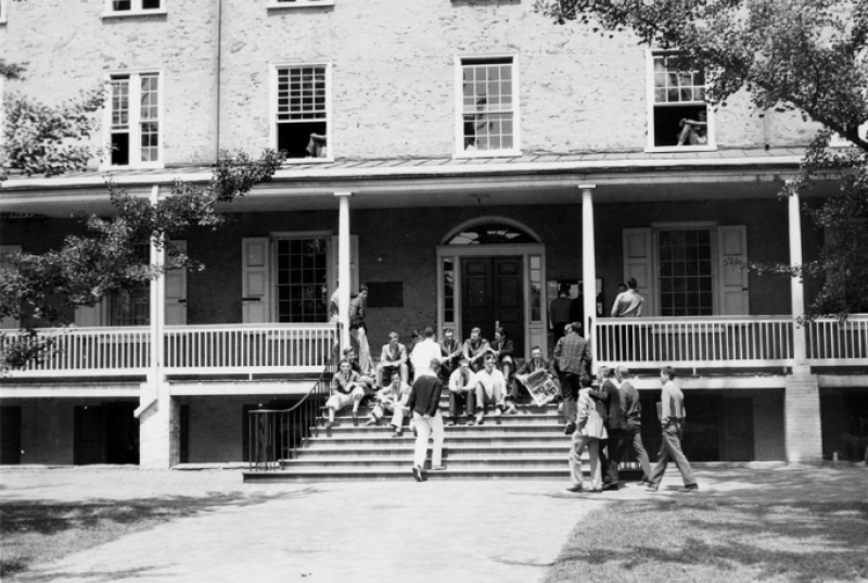black and white photo of people sitting on Founders stairs