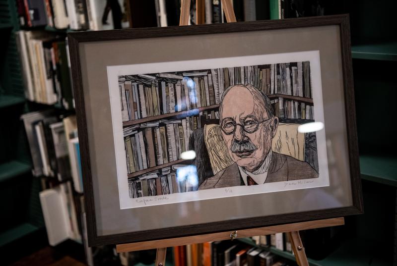 A framed portrait of Rufus Jones propped on an easel.