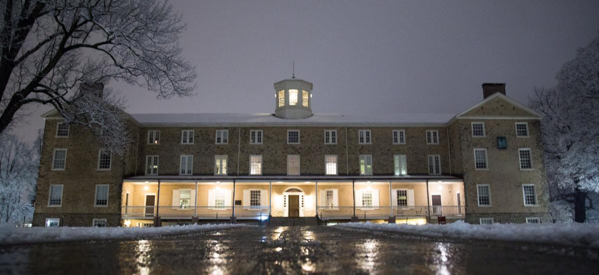 Founders hall at night after snow storm