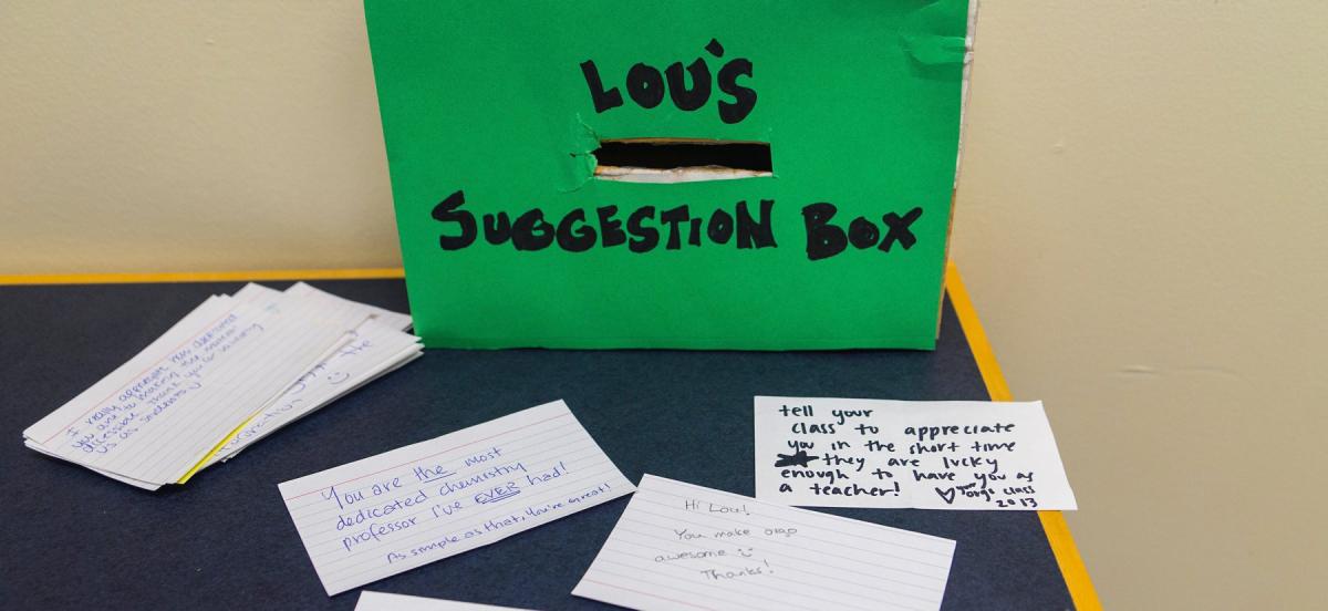 suggestion box with paper cards with suggestions written on them