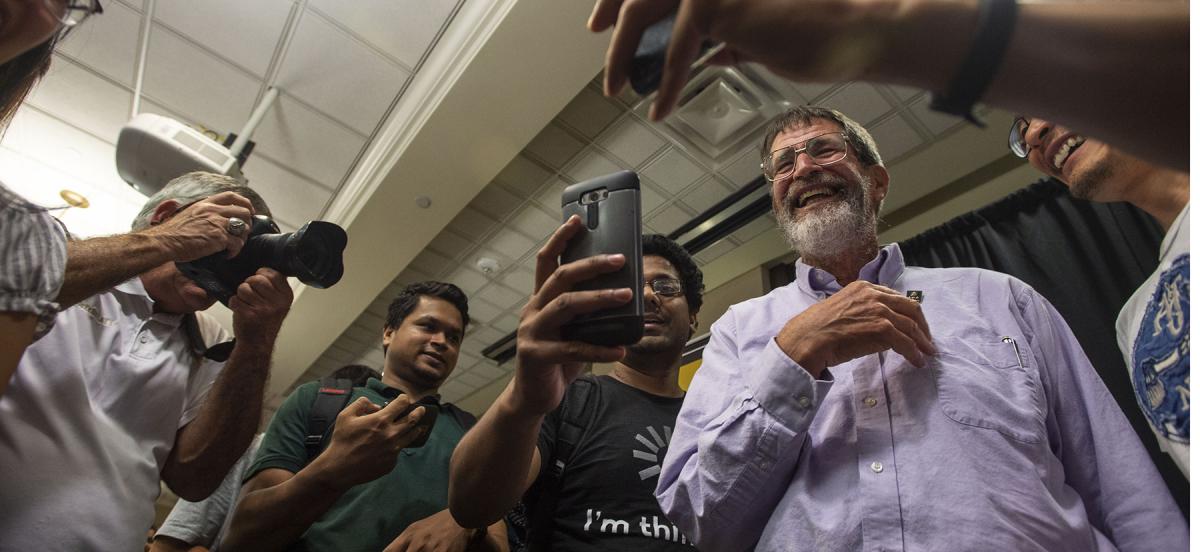 Nobel laureate George P. Smith is mobbed by selfie seekers at an event at the University of Missouri