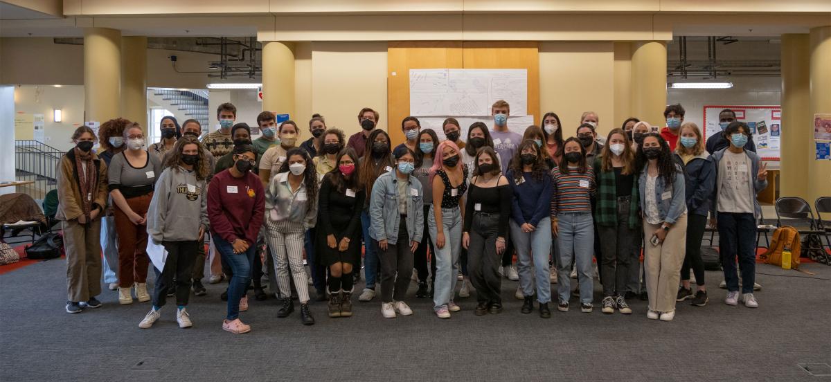 40 of this summer's CPGC supported interns pose, wearing masks, in Zubrow Commons