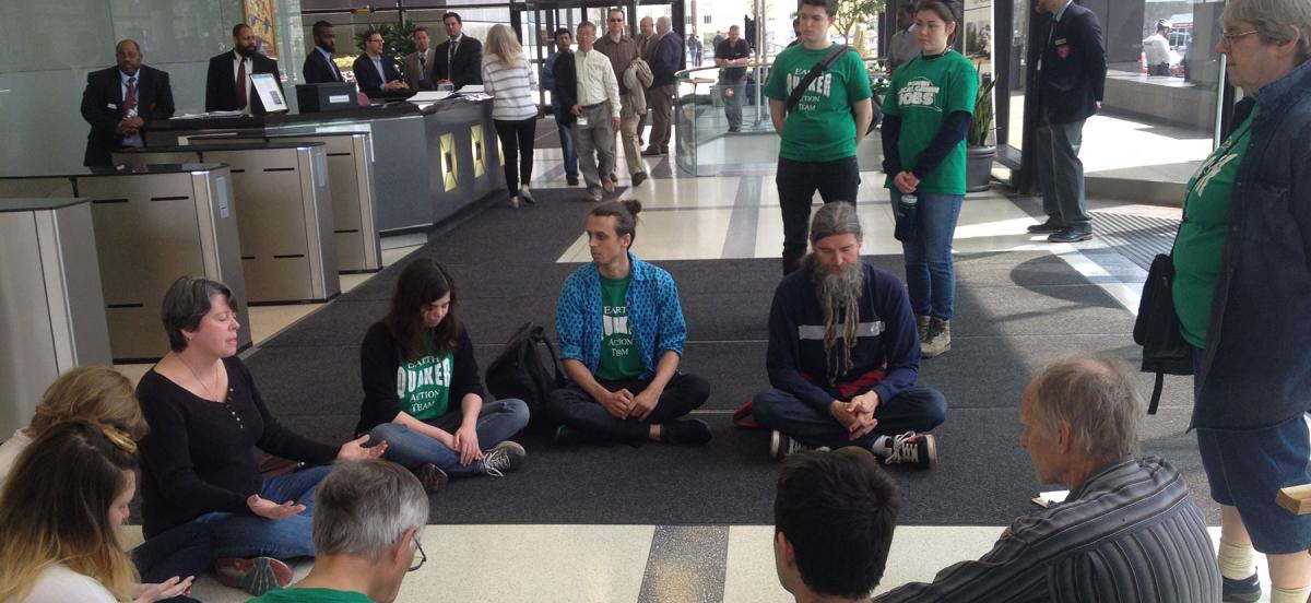 Earth Quaker members sitting in peaceful protest