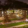 tritton and kim dorms at night with light shining from within